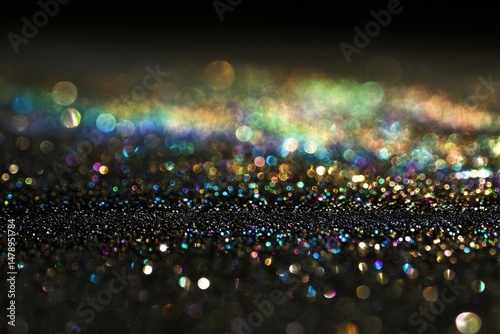 Vibrant bokeh lights sparkle in darkness.
