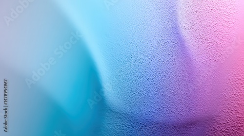 Abstract gradient texture in pink and blue tones.