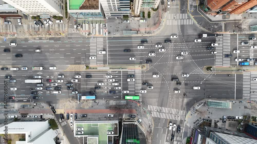 Drone aerial view of traffic flow and road markings at a large Seoul intersection