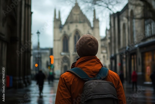 Man admires the stunning architecture of Saint Patrick's Cathedral in Dublin on a cloudy day, a man looks at saint patrick's cathedral in Dublin