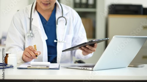 Doctor working in hospital use calculator, Healthcare and medical concept.