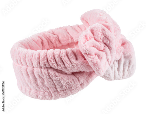 Soft pink headband with a large bow, made from plush fabric, designed for comfort and style.