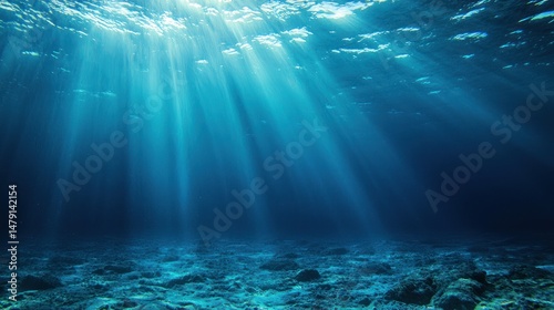 Sunlight rays penetrating the deep blue ocean