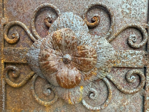Ornamental Rusted Metal Flower with Decorative Swirls