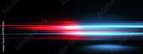Contrasting red and blue light streaks against a dark background.