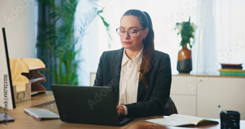 Obraz na plátně Business, woman and typing on laptop in office for legal research, case preparation and drafting lawsuit report