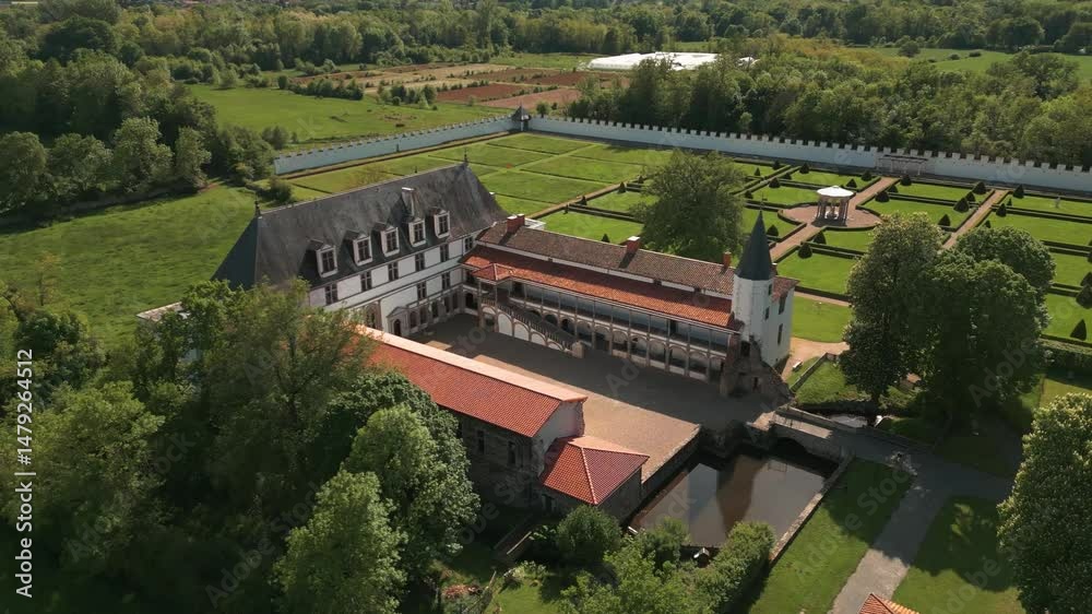 aerial shot around batie d'urfe castle in Saint Etienne le Molard in Loire departement on a suny day of spring, Auvergne Rhone Alpes departement, France