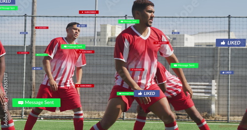 Training mid adult male player defending at artificial turf field, with social media overlays