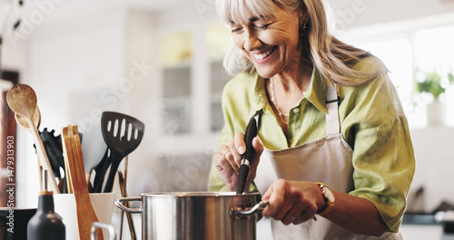 Fotografie Scent, cooking and mature woman in kitchen in home with smelling dinner, meal or dish