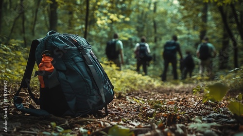 Child's backpack rests on forest floor as searchers look for missing person in wooded area