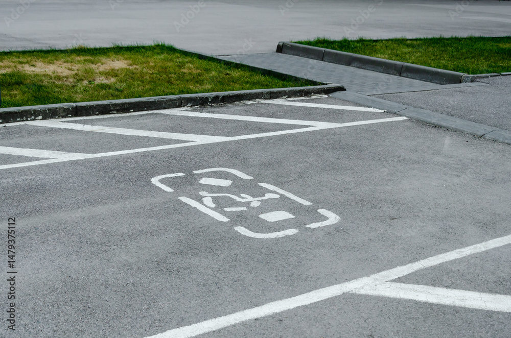 Obraz premium Disabled Parking Space Marking on Asphalt Road
