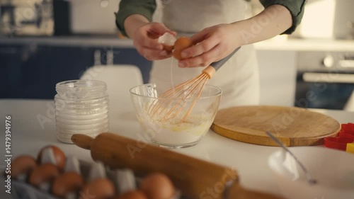 Woman adding egg and sugar to bowl with flour, preparing dough, following recipe