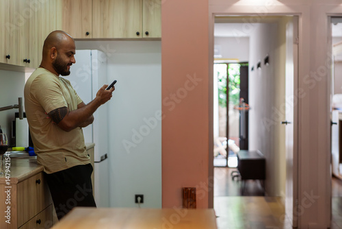 Modern hostel with cozy minimalist dorms, wooden capsule beds, and peaceful courtyard. Men chatting and relaxing in a quiet neighbourhood