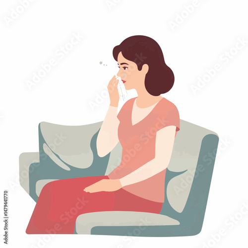 Woman wiping tears while sitting on a couch, emotional vulnerability