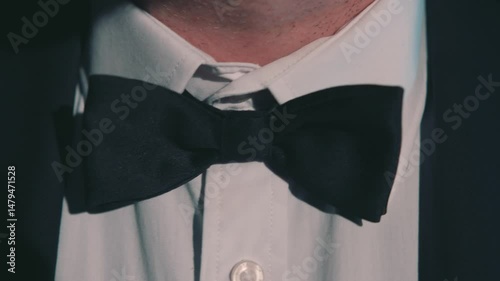 Man Adjusting Bowtie