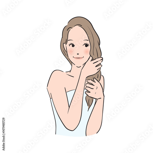 丁寧にヘアケアをするロングヘアの女性