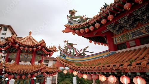 Red lanterns of a traditional chinese temple roof creating vibrant cultural ambiance during festive celebration, Thean hou temple, Kuala Lumpur, Malaysia.