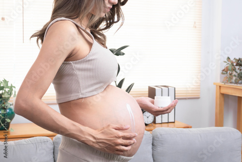 Unrecognizable hands apply moisturizing cream on belly pregnant to prevent stretch remarks, anonymous pregnant female health care routine concept of health and skin care, beauty during pregnancy Free Download Unrecognizable hands apply moisturizing cream on belly pregnant to prevent stretch remarks, anonymous pregnant female health care routine concept of health and skin care, beauty during pregnancy - GFXLoad