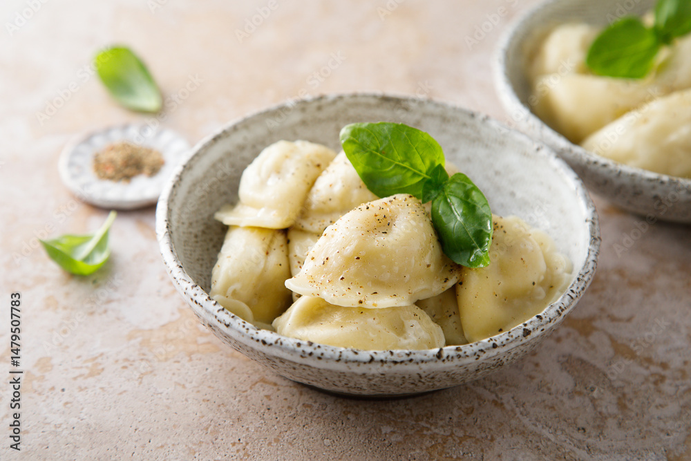 Homemade dumplings served with fresh basil Homemade dumplings served with fresh basil