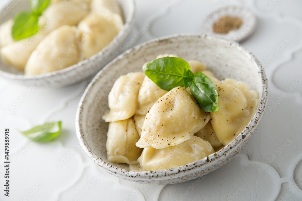 Homemade dumplings served with fresh basil Homemade dumplings served with fresh basil