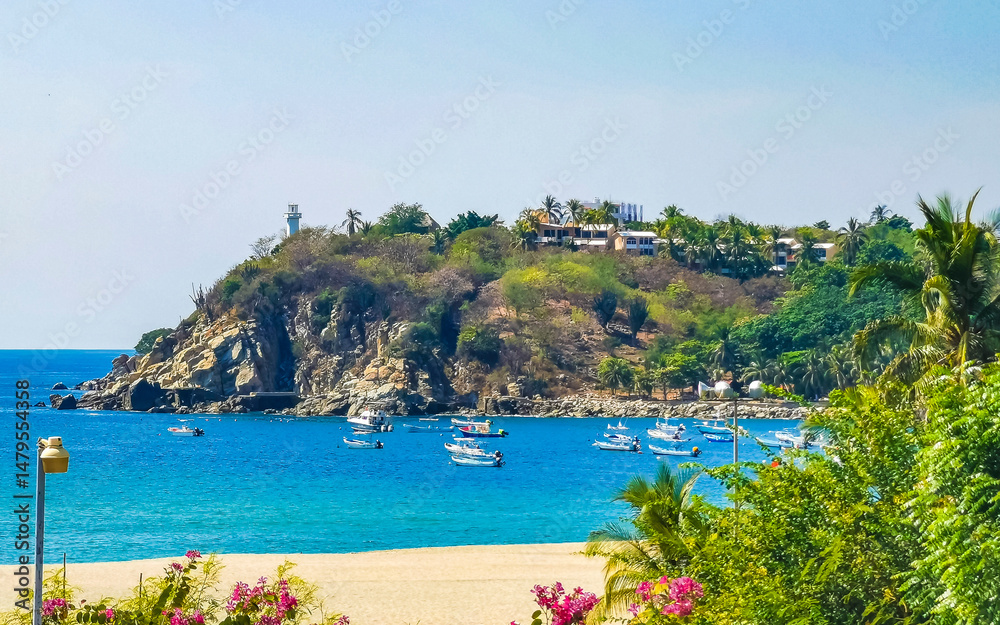 Fototapeta premium Fishing boats at the harbor beach in Puerto Escondido Mexico.