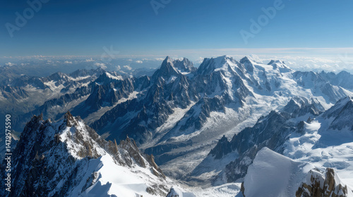 Mont Blanc View from Aiguille du Midi with Alpine Snowy Ridge and Blue Sky. Snowy Mountain Peaks