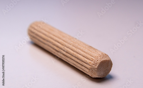 фотографія Close up of wooden dowel used in flat pack furniture assembly