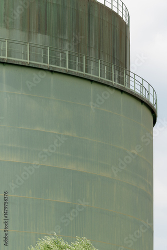 Huge heavy oil tank for the industry. Close up. Vertical shot.