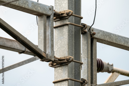 Closeup of railway mast for trolley system.