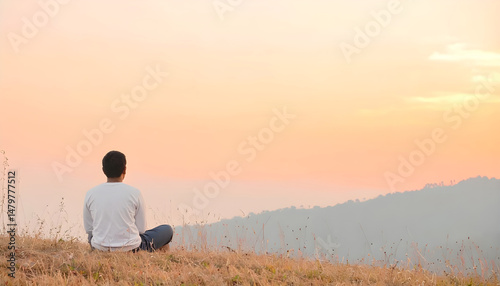 Person Contemplating Sunset on Grassy Hill