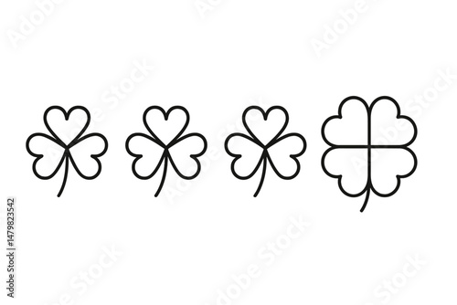 Set of four simple web icons featuring different styles of clover leaves for digital design