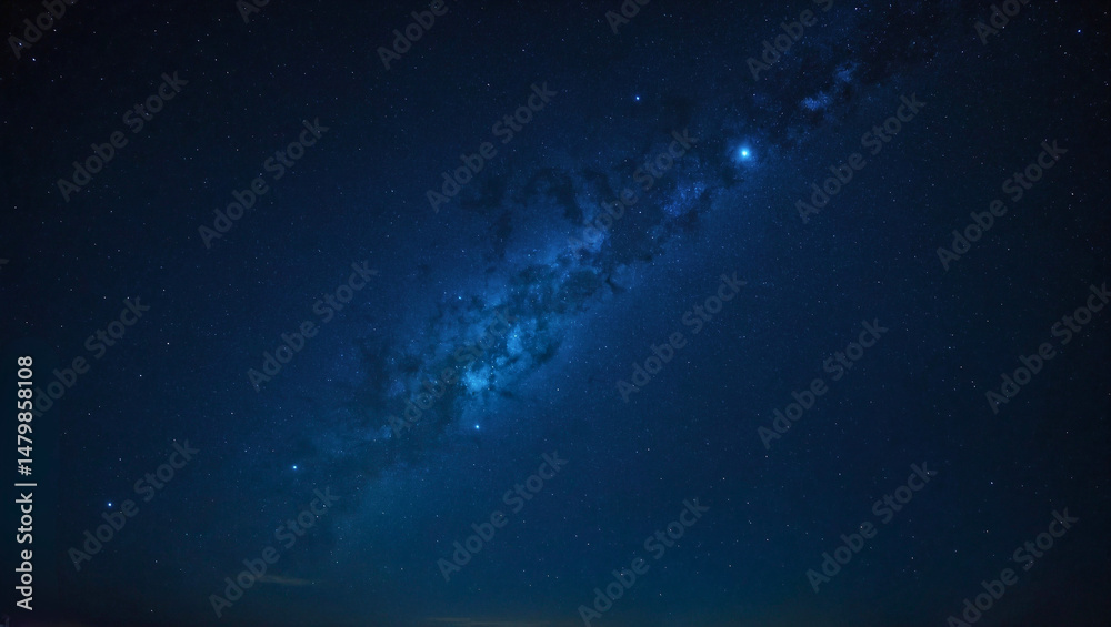 Fototapeta premium Starry sky background, blue night sky full of stars, glowing stars in the dark space, starry background, dark night, stars in the distance, starlight, dark background with a blue glow, night sky.