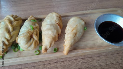 Fried Dumplings with Soy Sauce, Crispy Snack, Asian Street Food Platter. High quality 4k footage