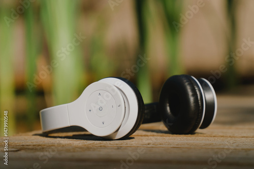 White wireless headphones on a terrace outdoors