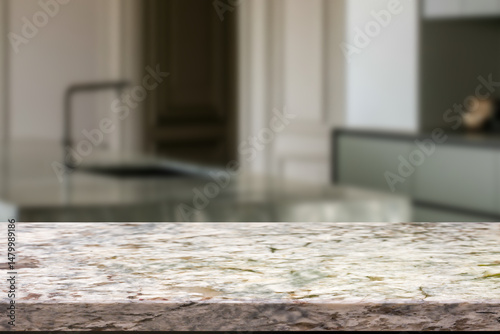 Empty wooden kitchen counter mockup, product display background. Wood table top on marble, blurred interior. Modern style home kitchen, restaurant advertising. Copy space for food, drinks, dishes