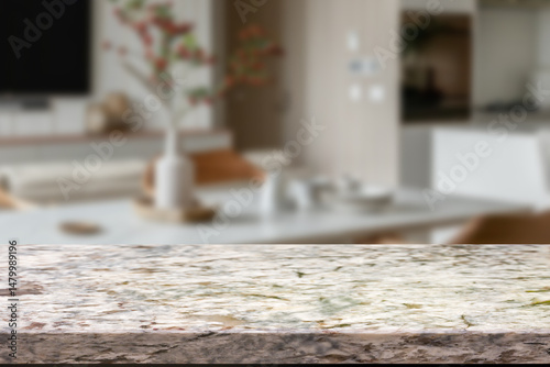 Empty wooden kitchen counter mockup, product display background. Wood table top on marble, blurred interior. Modern style home kitchen, restaurant advertising. Copy space for food, drinks, dishes
