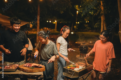 Wallpaper Mural Asian people Enjoying Summer BBQ Party, Cooking Delicious Meat Grill for Friends, Sharing Fun and Happy Moments Together, Embracing a Lifestyle of Friendship Dinner at Night Torontodigital.ca