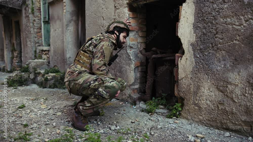 Soldier Looks Through The Destroyed Door Of An Old House Soldier Looks Through The Destroyed Door Of An Old House