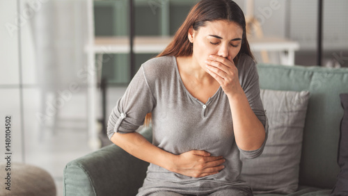 Young woman feeling nauseated