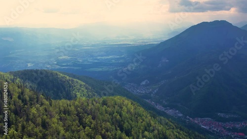 Aerial drone fly over sunset mountain range in Kranjska Gora, Slovenia. Tracking shot
