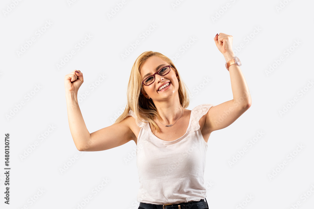 Obraz premium Winner happy blond woman celebrating success on white background