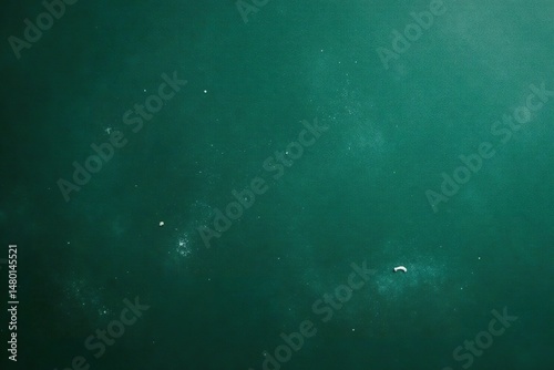 Close-up of a classic dark green chalkboard with chalk dust , educational supplies, black, detail