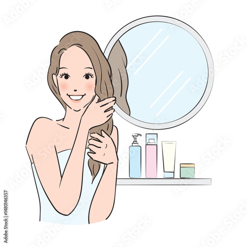 丁寧にヘアケアをするロングヘアの女性