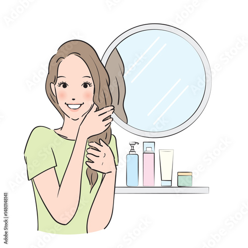 丁寧にヘアケアをするロングヘアの女性