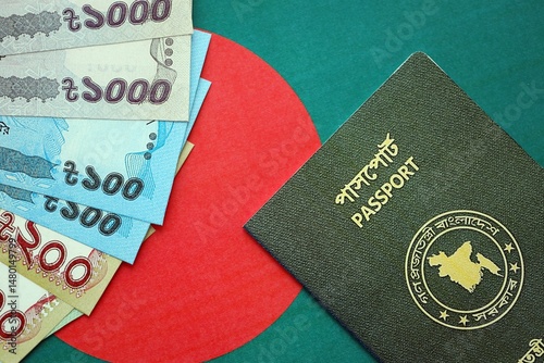 Bangladeshi taka money bills in big amount and passport lies on Bangladesh flag close up
