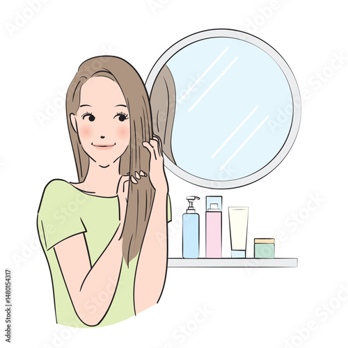 丁寧にヘアケアをするロングヘアの女性