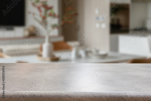 Empty wooden kitchen counter mockup, product display background. Wood table top on marble, blurred interior. Modern style home kitchen, restaurant advertising. Copy space