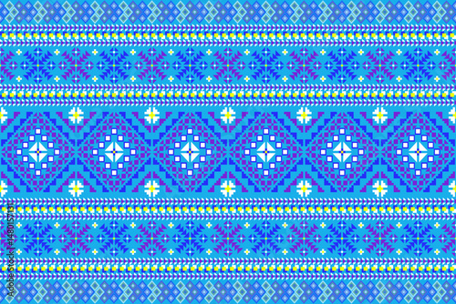 This textile pattern features a vibrant mix of geometric and tribal motifs, reflecting the charm of traditional ethnic fabric. The textile pattern stands out beautifully  blue background