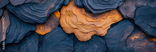 Textured Terrain: A symphony of stratified rock in dark indigo and golden amber, evoking a sense of deep geologic time and intricate natural formation