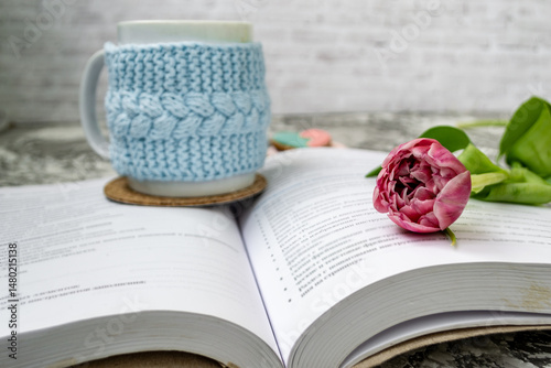 Pink tulips, an open book and a mug of freshly brewed coffee or tea. Spring set. Flatley layout.